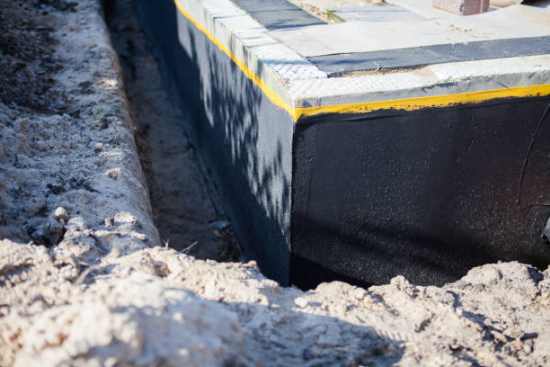 Professional Waterproofing technician working in Casstown, OH